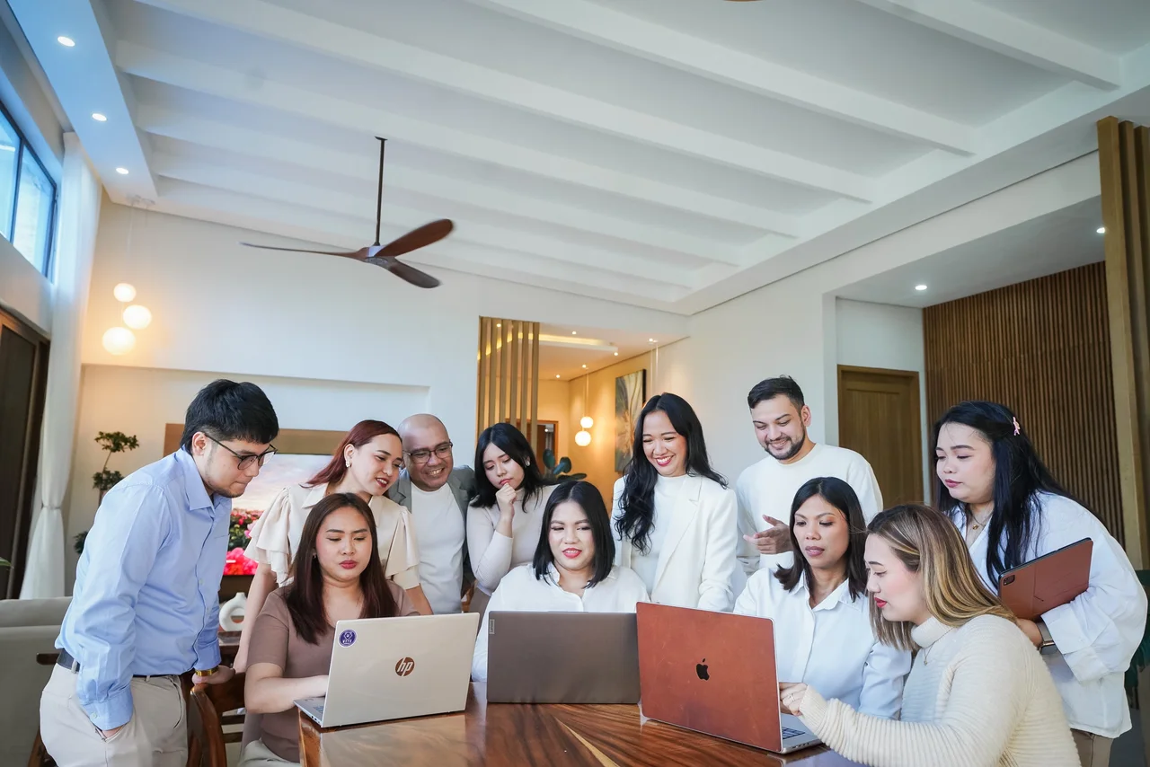 The Dream Assistant team collaborating around a table, ready to support your next chapter